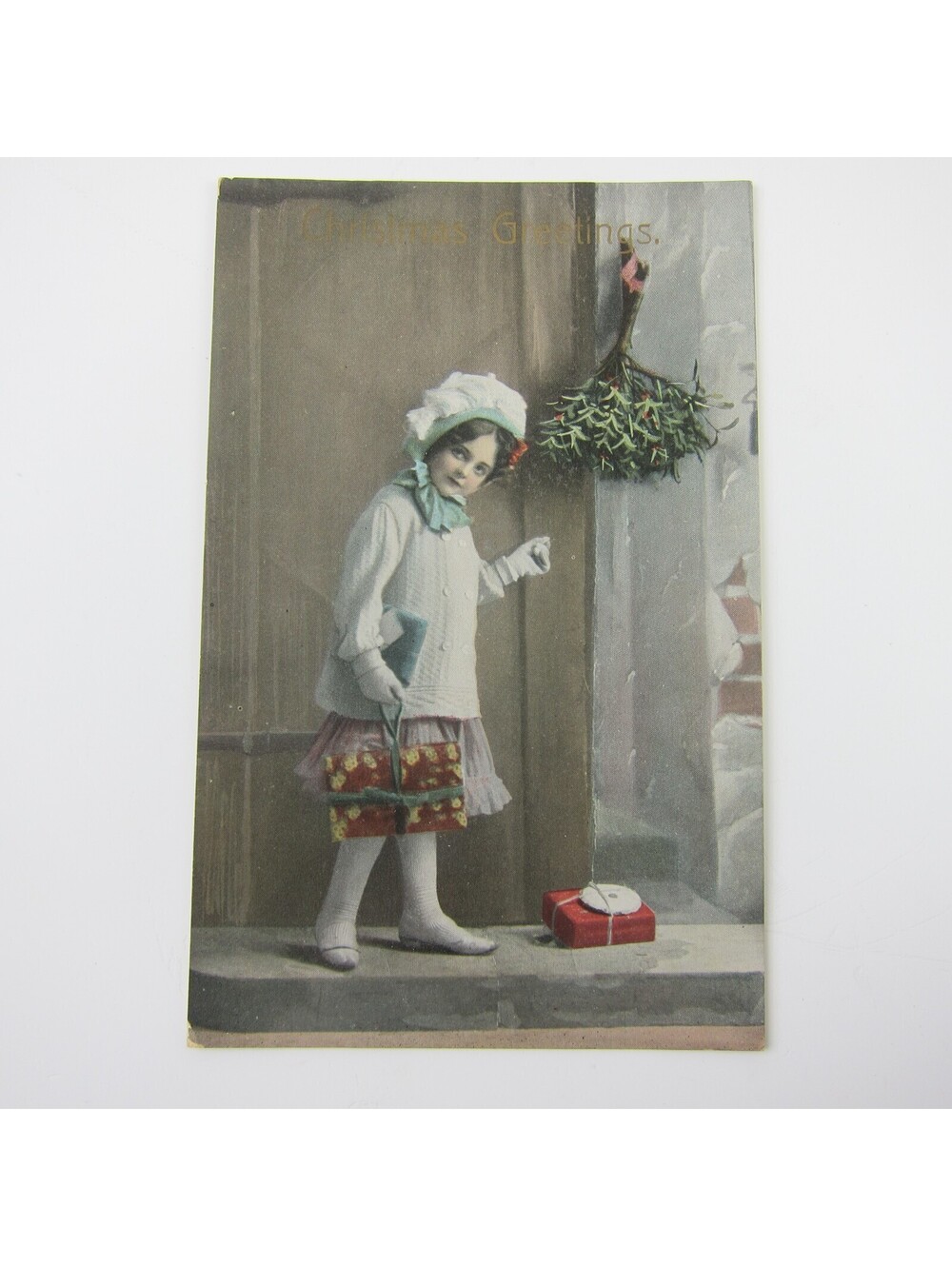 Christmas Postcard Victorian Girl White Sweater Hat Wrapped Gift Package Antique